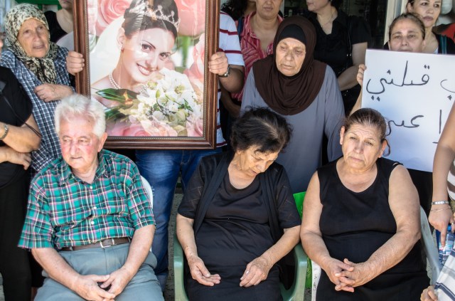Roula's mother is sitting in the middle. She could barely handle herself. Between her tears and her cries, there wasn't much any of us could say. On the left sits her father. He kept on trying to maintain a image of strength but soon left when he couldn't control himself anymore.