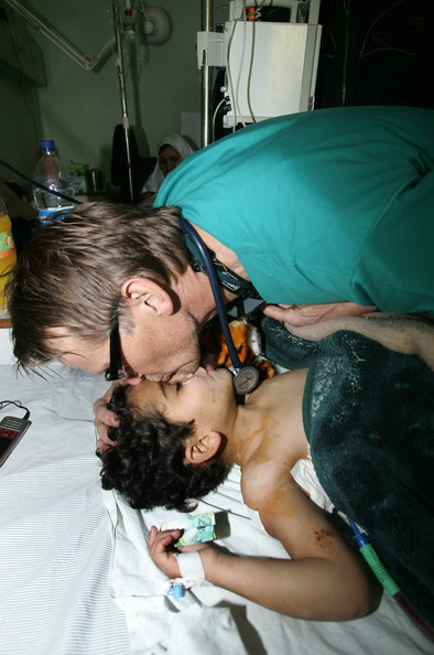 The widely shared photo of Dr Gilbert with a patient in Al Shifa Hospital during 'Operation Protective Edge'